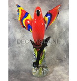 Colorful Scarlet Macaw parrot of glass