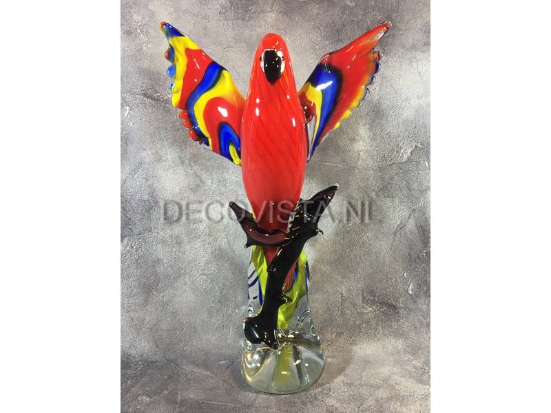 Colorful Scarlet Macaw parrot of glass