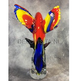 Colorful Scarlet Macaw parrot of glass