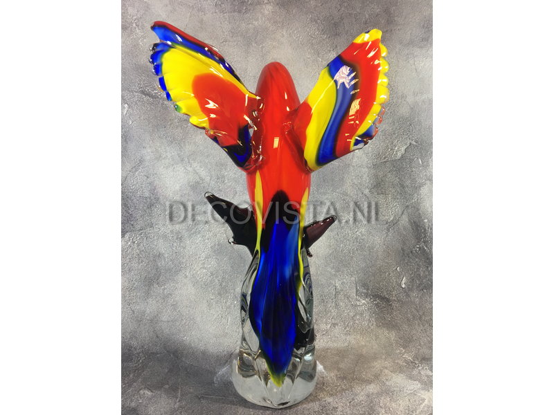 Colorful Scarlet Macaw parrot of glass