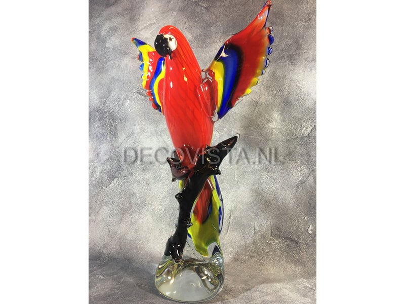 Colorful Scarlet Macaw parrot of glass