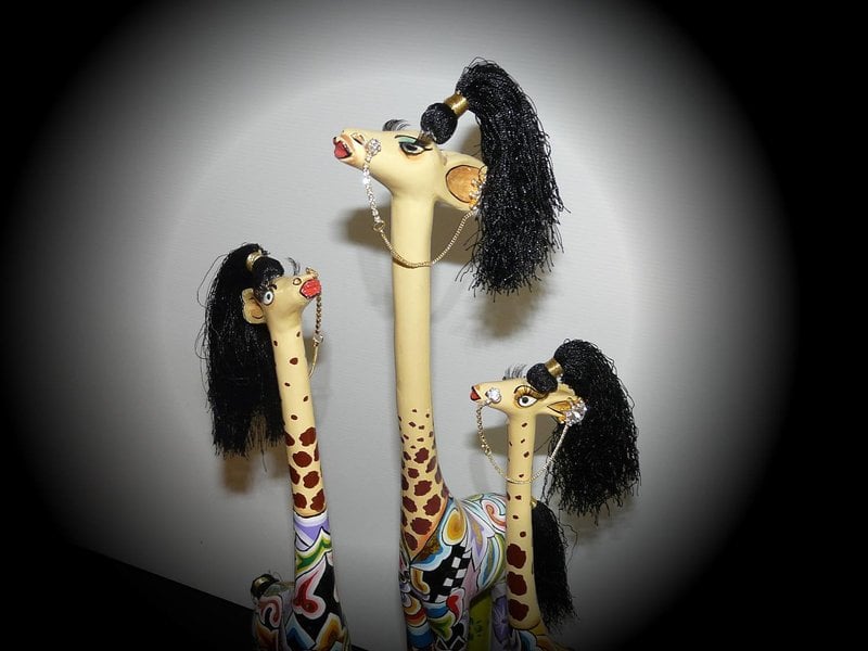 Toms Drag Figurine Giraffe Carmen on pedestal