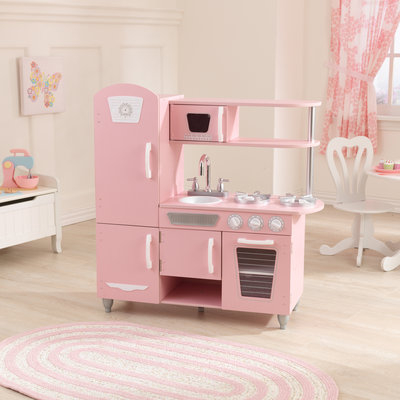 Cuisiniere en bois rose pour enfants