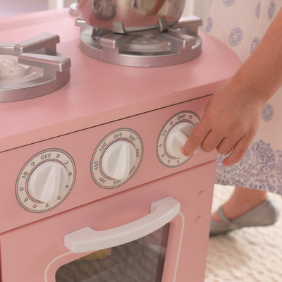 Cuisiniere en bois rose pour enfants