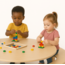 Round wooden table for Lego with integrated bench