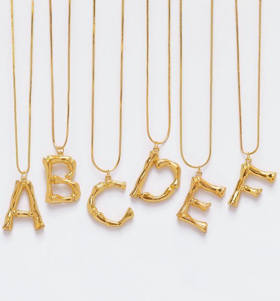 Adamarina - Golden Letter A pendant 
