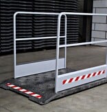 Construction site footbridge with grey handrails