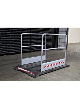 Construction site footbridge with grey handrails