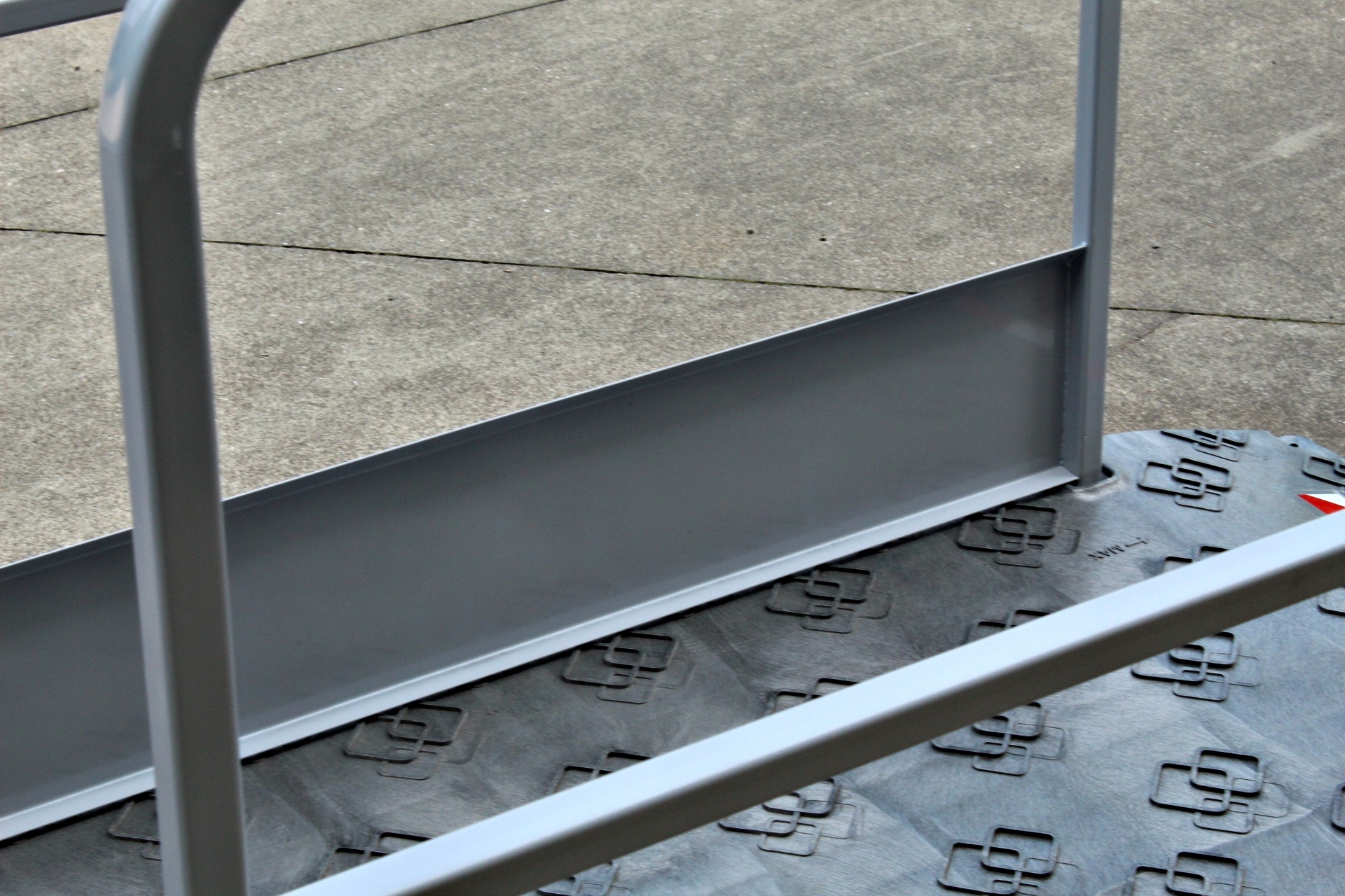 Construction site footbridge with grey handrails