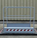Construction site footbridge with grey handrails