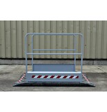 Construction site footbridge with grey handrails