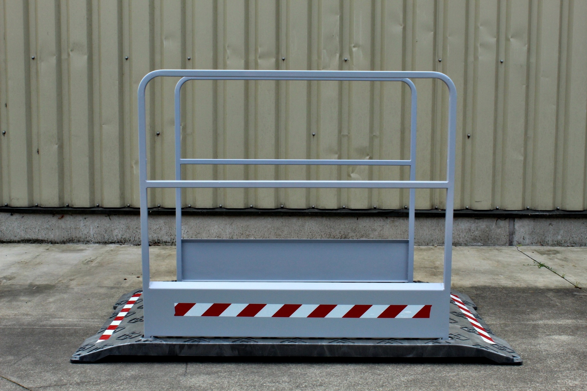 Construction site footbridge with grey handrails