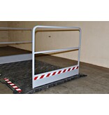 Construction site footbridge with grey handrails