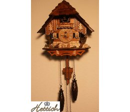 Hettich Uhren Cuckoo clock with quartz movement 20cm high and 17cm wide with 12 different melodies Cuckoo calls every hour Cuckoo eg 10 o'clock he calls 10x cuckoo the cuckoo call is effectively supported and played by an echo and a waterfall sound in the background