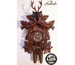Hettich Uhren Reloj de cuco de 40 cm de alto originalmente elaborado a mano en la Selva Negra con tallado de motivos de caza artesanales