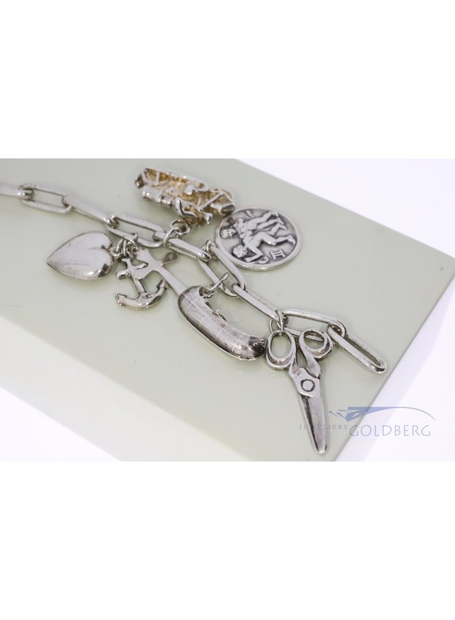 silver charm bracelet with 14x charms