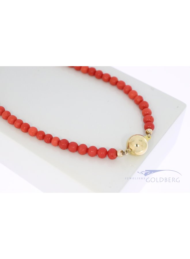red coral necklace with 14k gold clasp.