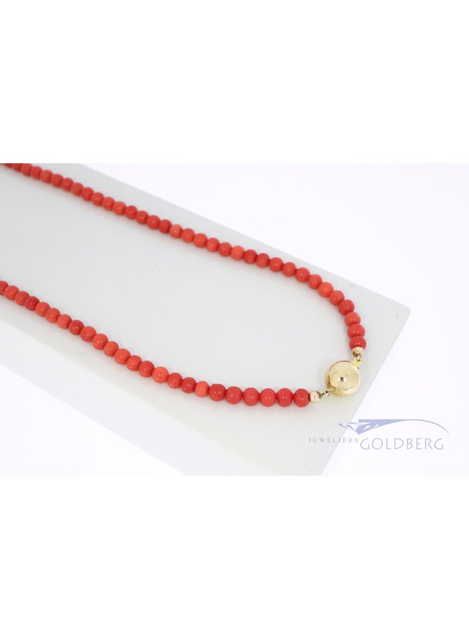red coral necklace with 14k gold clasp.