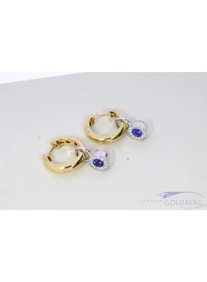 Tirisi creoles with sapphire and diamond pendants.