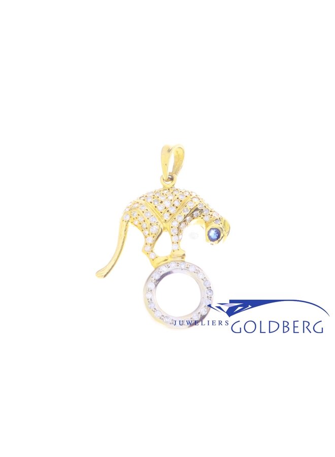 18 carat bicolor gold panther pendant with ca. 0.92ct brilliant cut diamond and sapphire