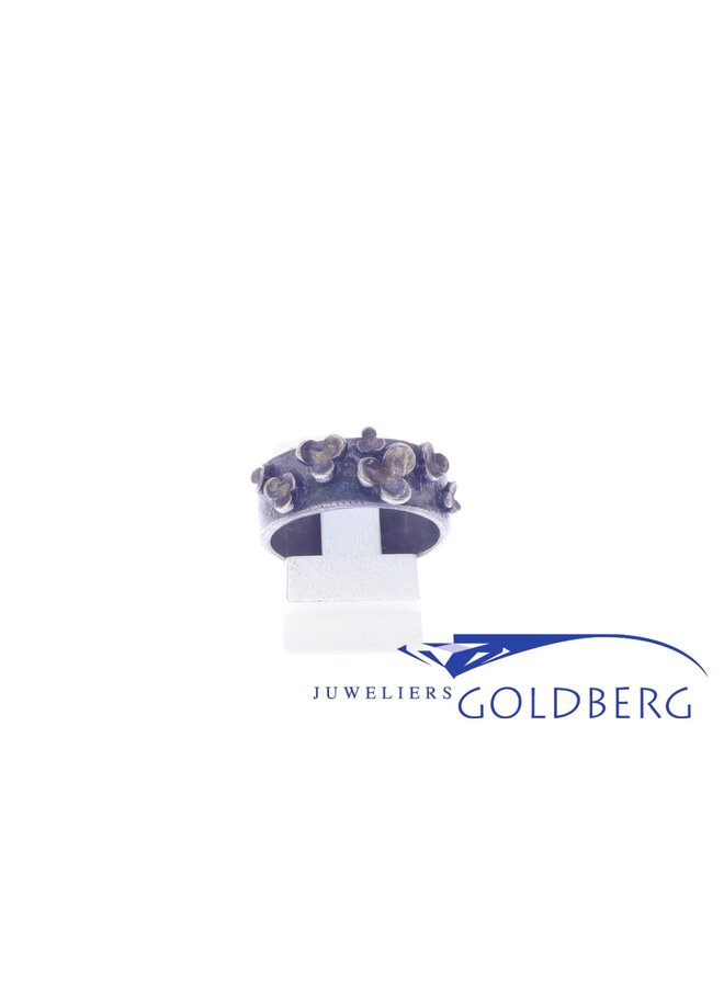 Rabinovich oxidized silver ring with flowers.