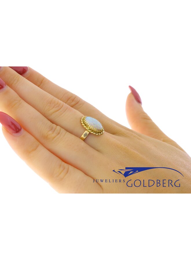 14k gold ring with synthetic opal from our own studio