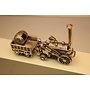Miniature silver locomotive with coal wagon